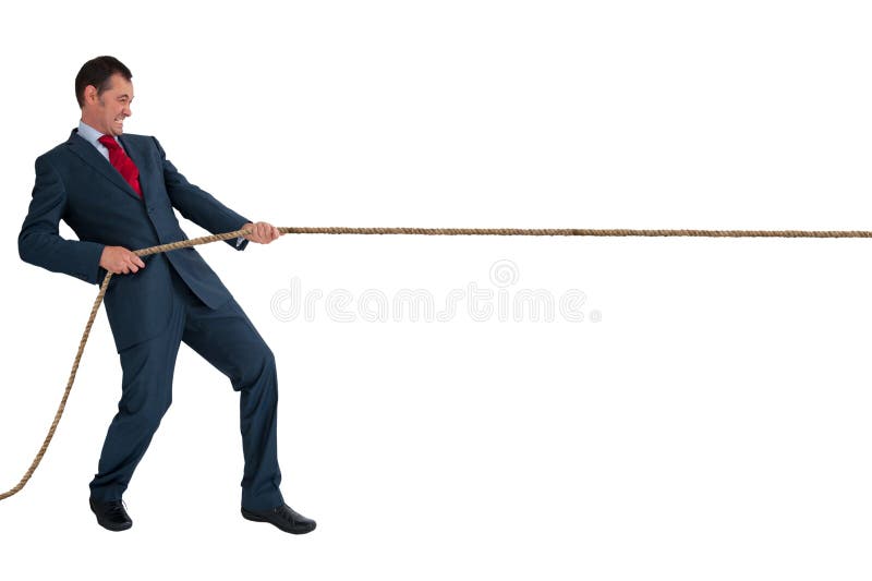 Businessman pulling a rope stock photo
