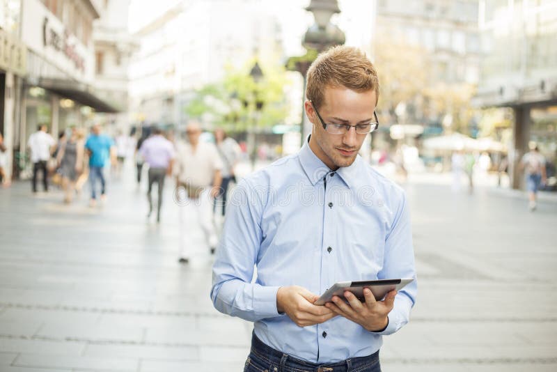 Businessman read news on Tablet Computer