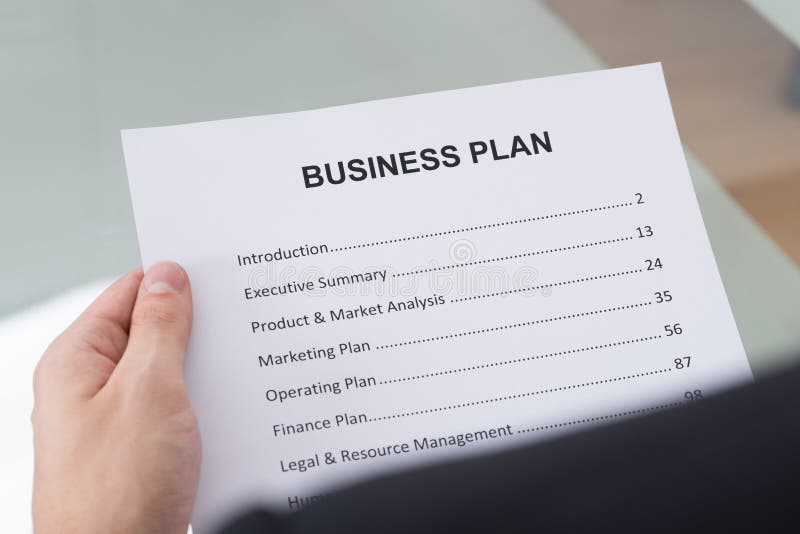 Businessman reading business plan royalty free stock photos