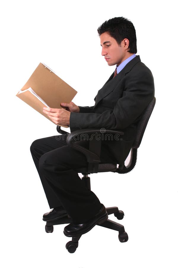 Businessman reading different documents and holding a folder. Businessman reading different documents and holding a folder