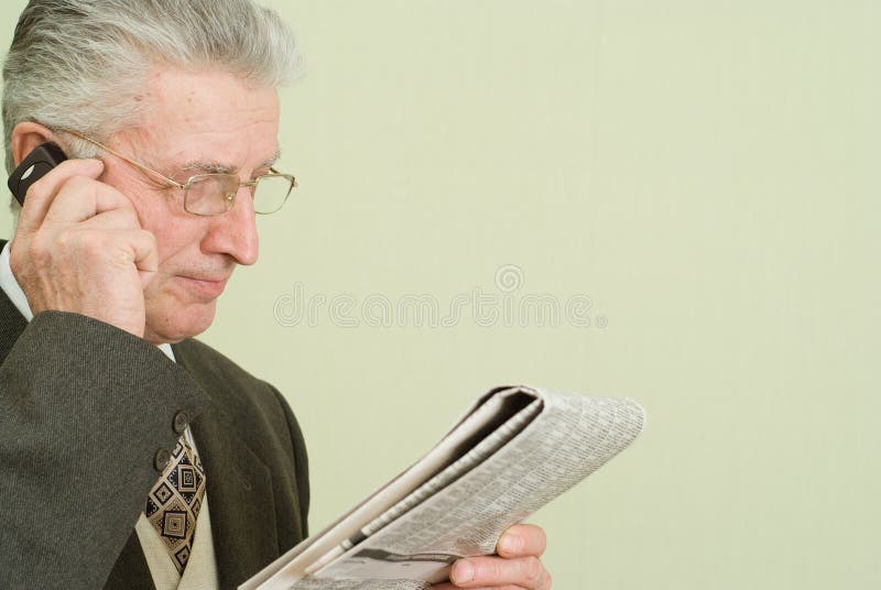 Businessman reading newspaper