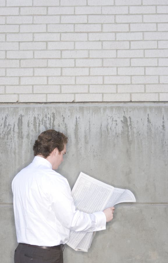 Businessman reading newspaper