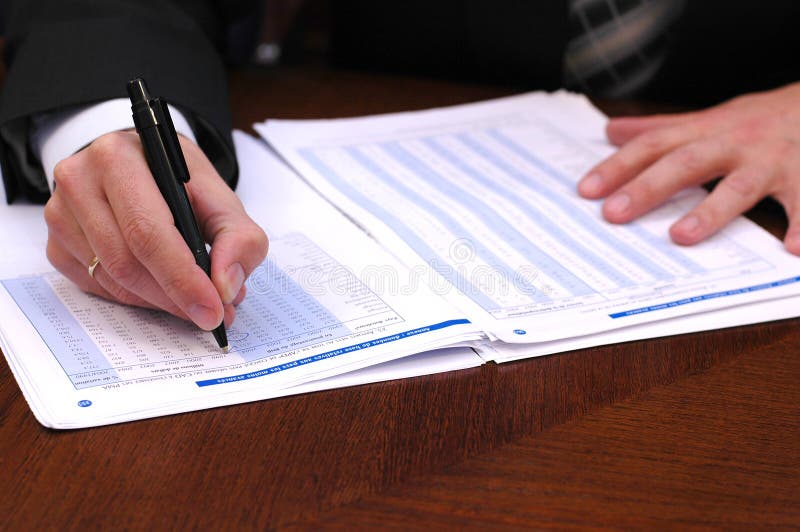 Businessman reads financial report 3