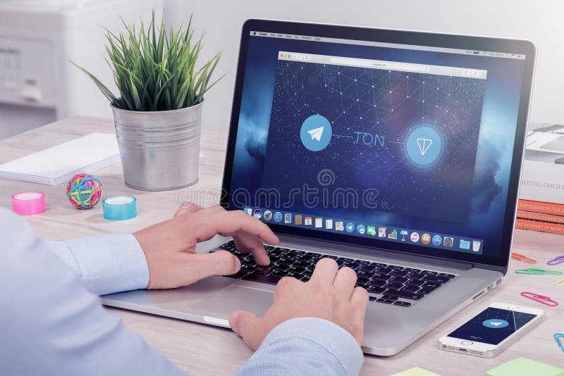 Businessman reads Telegram Open Network TON white paper on ICO rating website