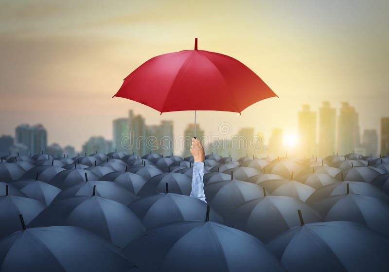 Businessman with red umbrella among others, unique different concept