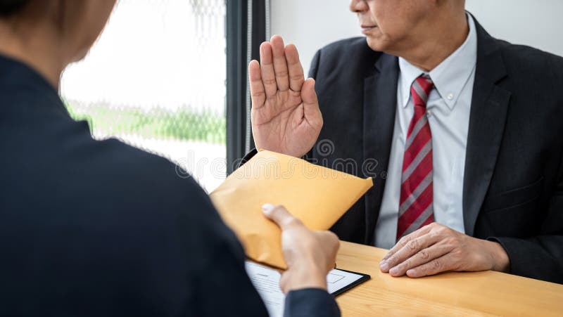 Businessman is refuses don`t receive to accept banknote money and terms of contract from corruption bribe employer in signing royalty free stock image