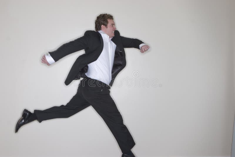 Businessman running royalty free stock image