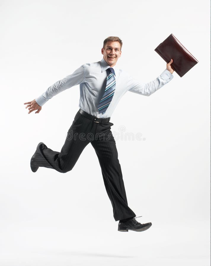 Businessman running stock image