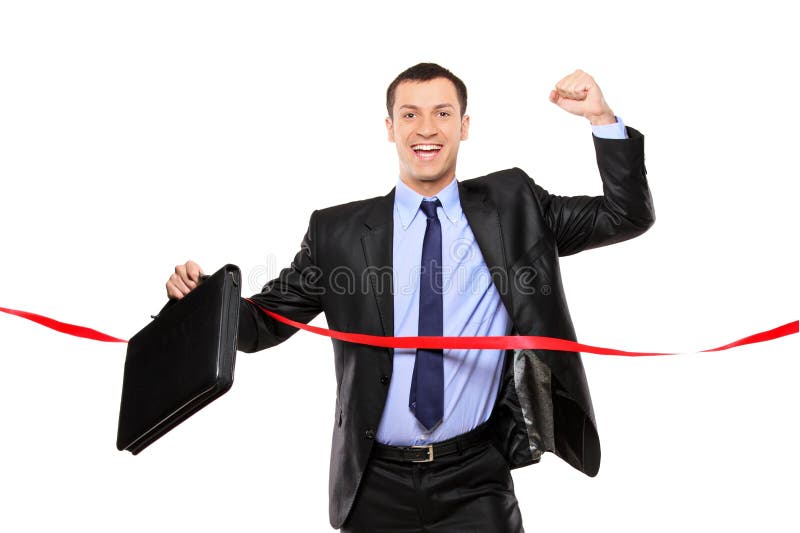Businessman running at the finish line royalty free stock photo