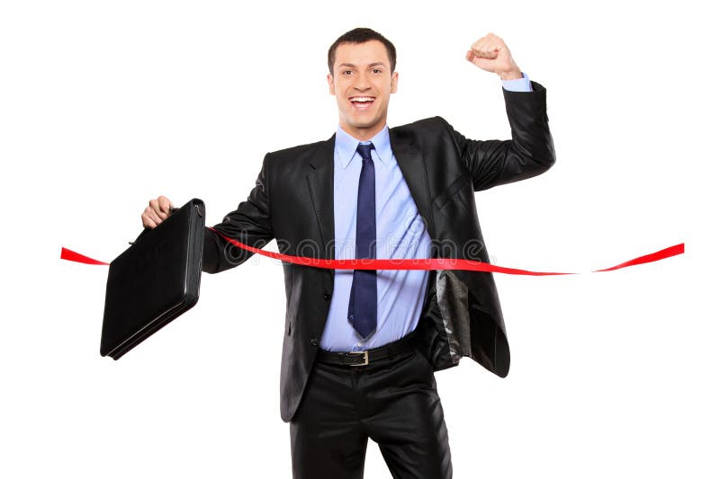 Businessman running at the finish line royalty free stock image