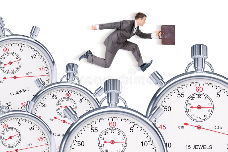 Businessman running with set of timers stock photo
