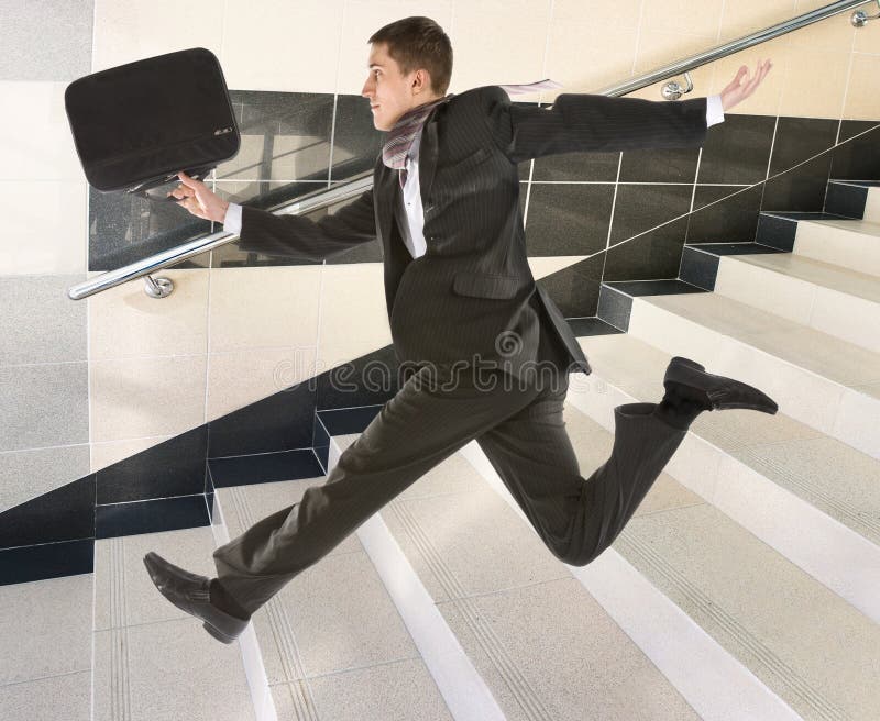 Businessman running on stair