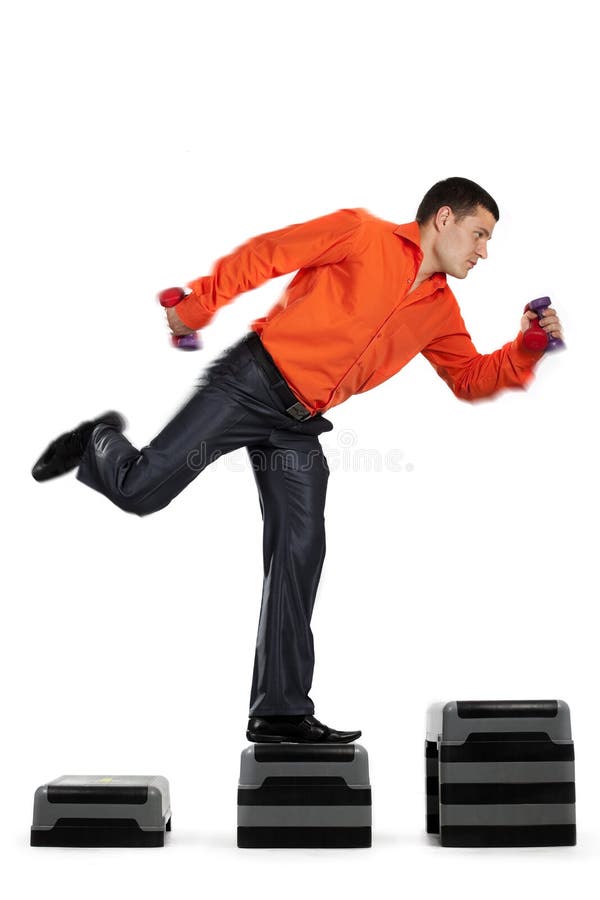 Businessman running up with dumbbells stock photos