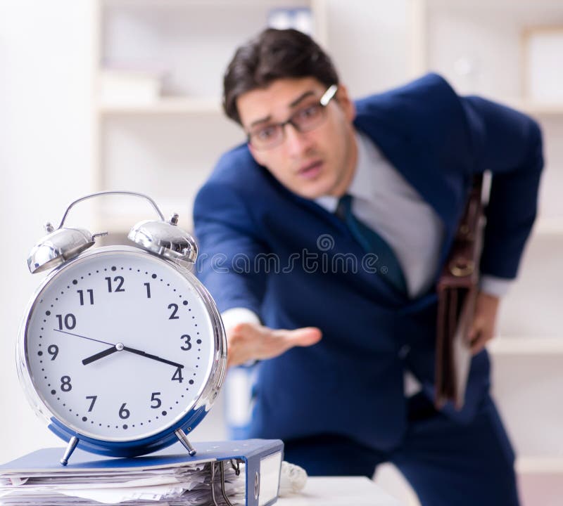 Businessman in rush trying to meet deadline stock photo Businessman in rush trying to meet deadline stock photo