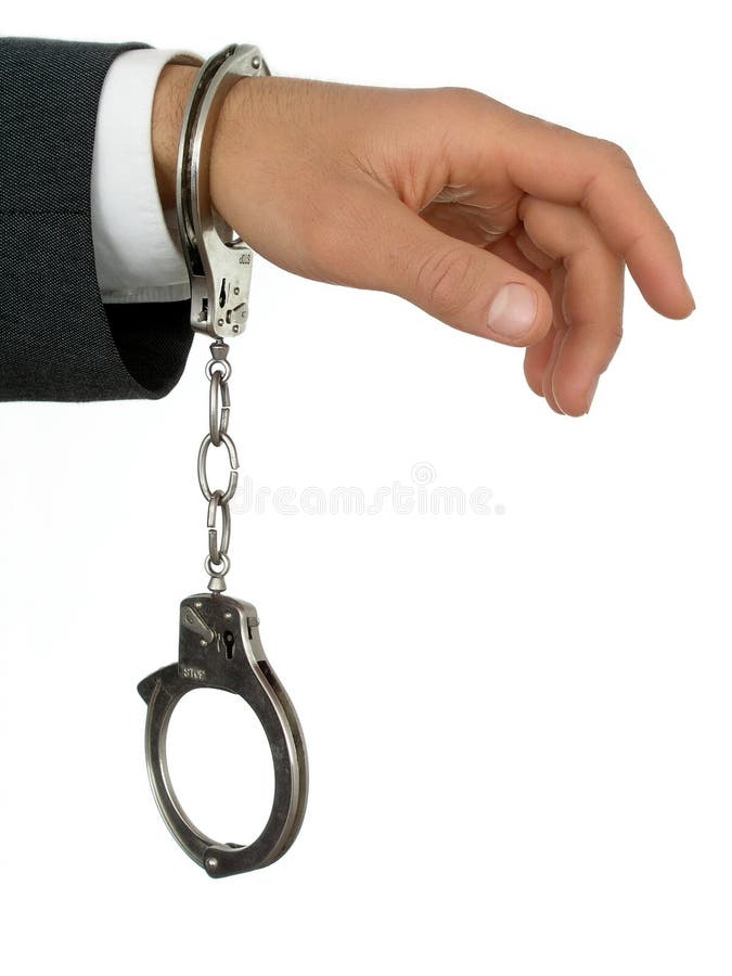 Businessman's Hand In Handcuffs - isolated. Male hand holding businessman stock images, royalty-free photos and pictures