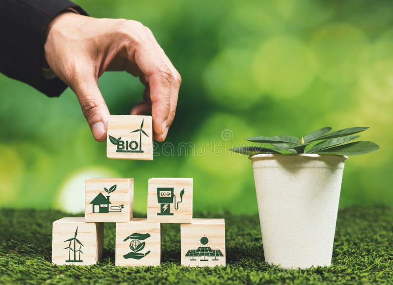 Businessman&#x27;s hand holding eco-concern symbol and plant pot. Alter