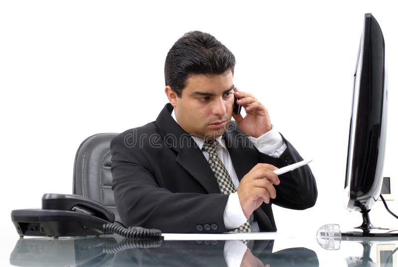 Series - Businessman on the phone in the office . Series - Businessman on the phone in the office .