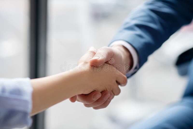 Businessman shaking hand of his assistant after help and assistance royalty free stock images