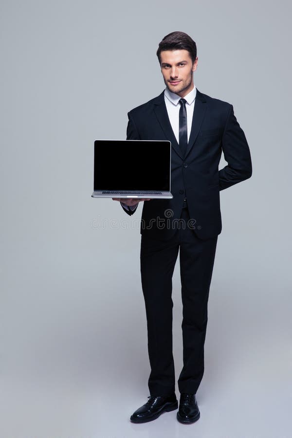 Businessman showing blank laptop screen stock photography Businessman showing blank laptop screen stock photography