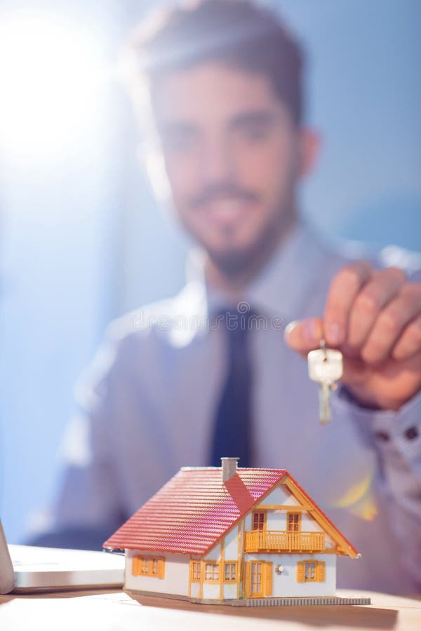 Businessman showing a key royalty free stock photos Businessman showing a key royalty free stock photos