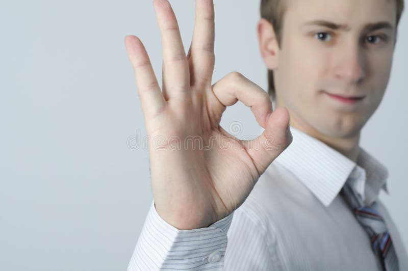 Businessman shows ok sign