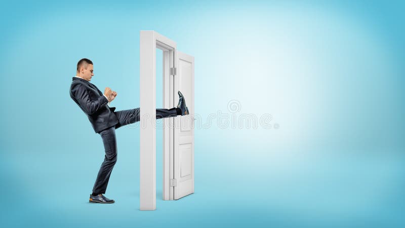 A businessman in side view kicks a small white door open with his leg on blue backgrounds.