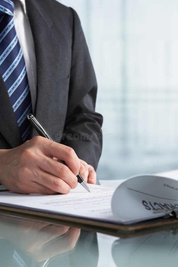 Businessman signing contract stock photos