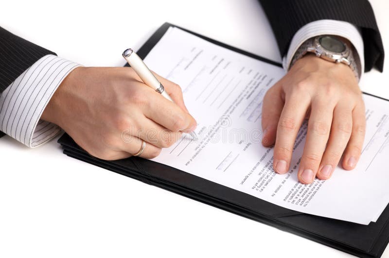 Businessman signing a contract royalty free stock images