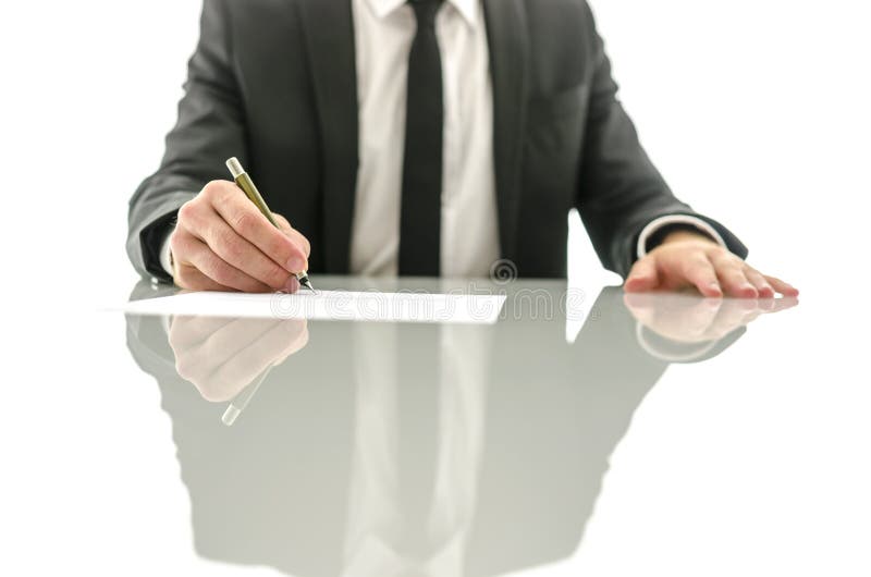 Businessman signing contract stock photos