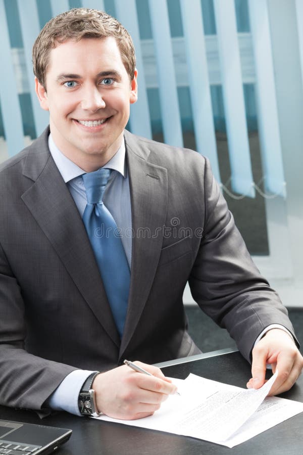 Businessman signing document stock photography