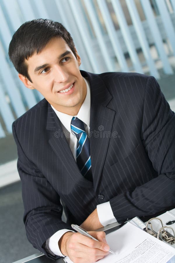 Businessman signing document royalty free stock photos