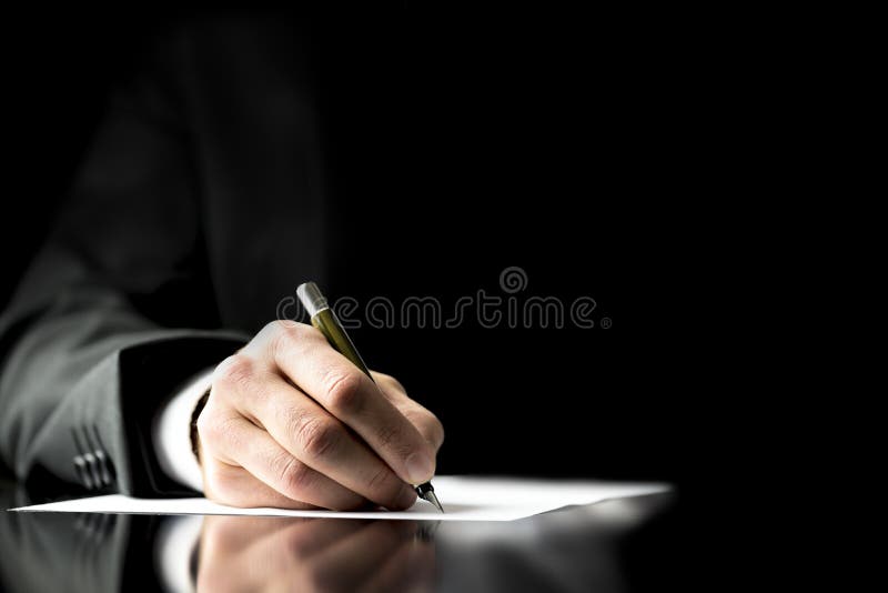 Businessman signing a document royalty free stock images