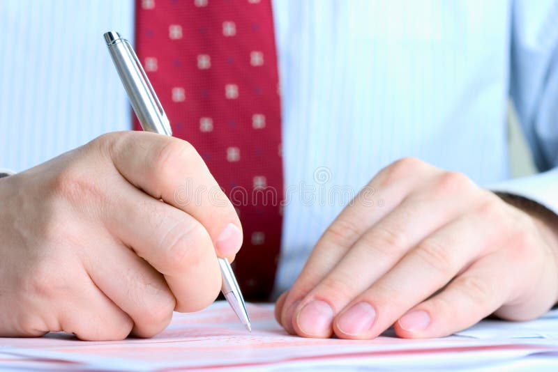 Businessman signing documents royalty free stock photos