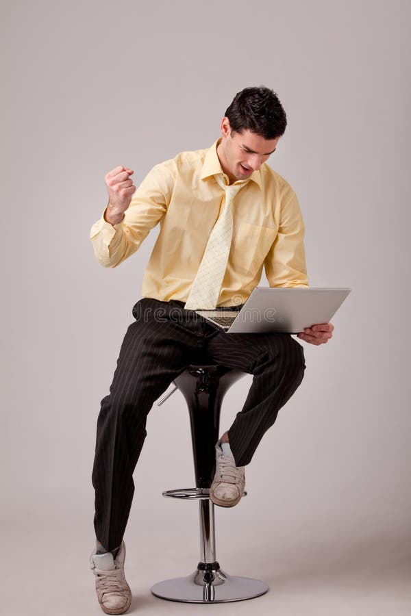 Businessman sitting on barstool