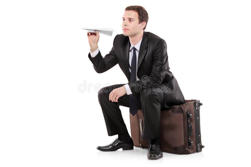 Businessman sitting on a luggage royalty free stock image Businessman sitting on a luggage royalty free stock image