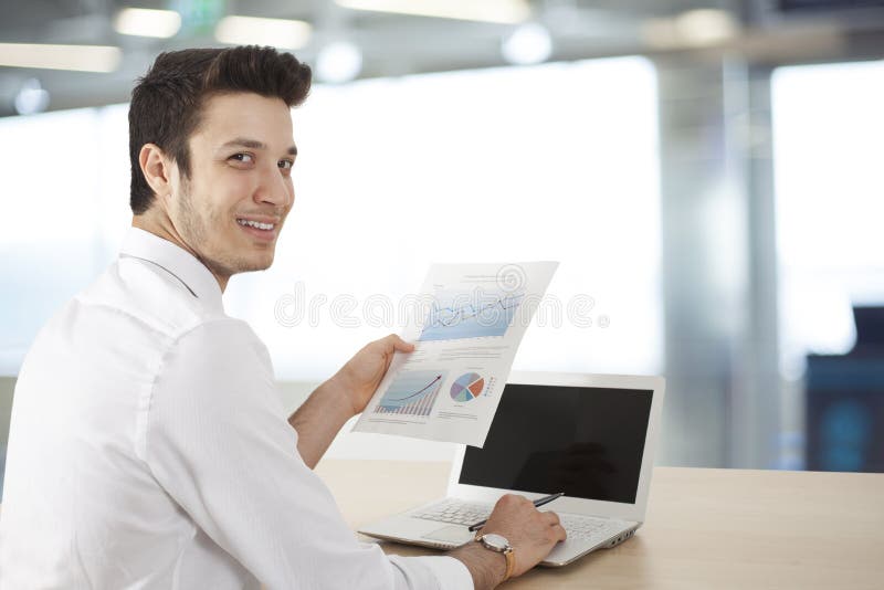Businessman sitting table and holding document royalty free stock images