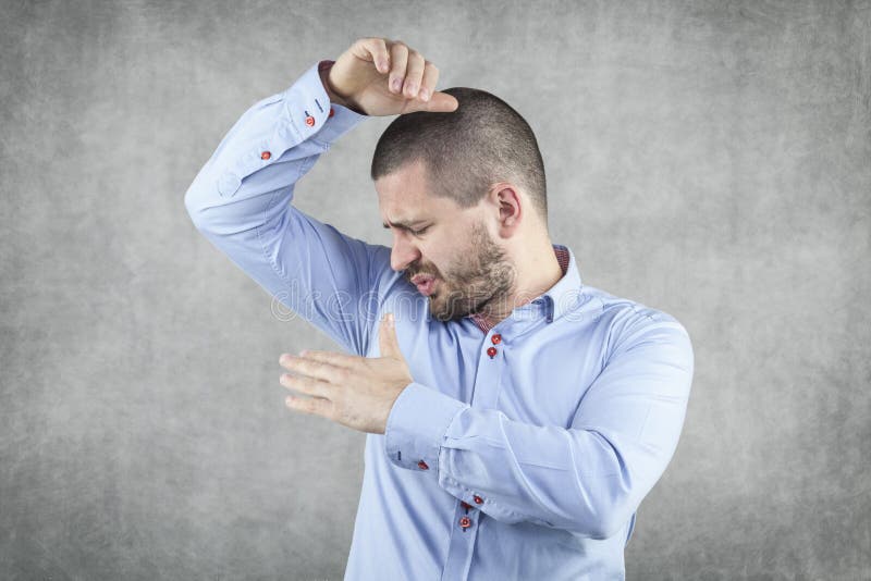 Businessman Smelling His Armpits Stock Photo - Image of normal ...