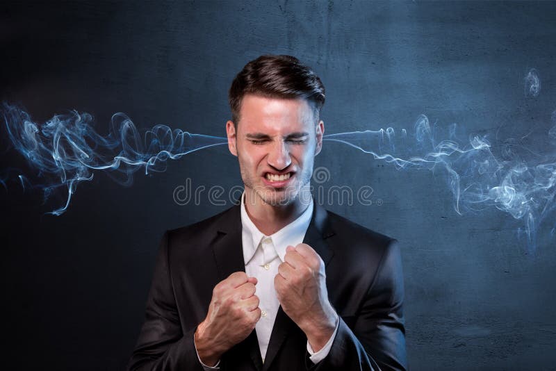 Businessman smoking with anger