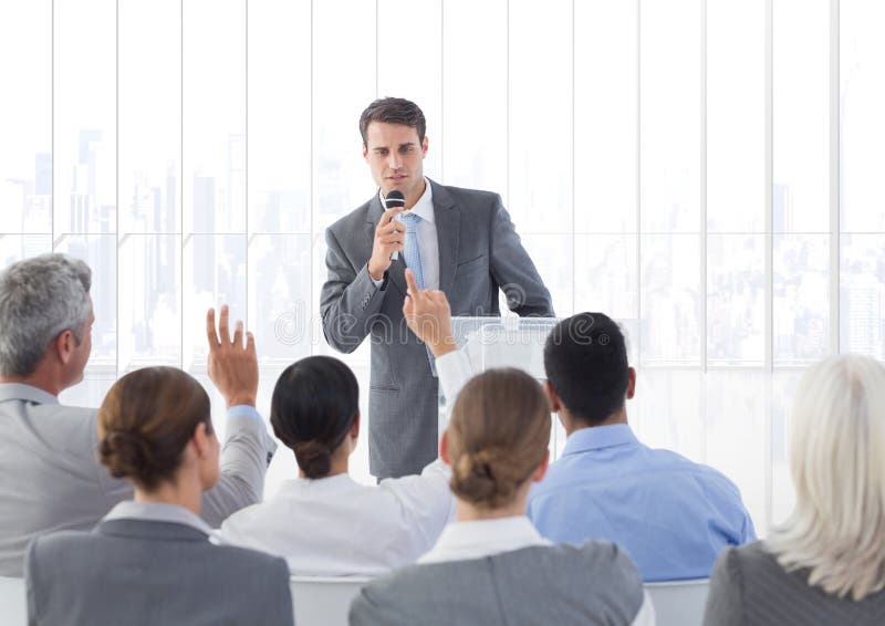 Businessman Speaking through Microphone during Seminar Stock Image