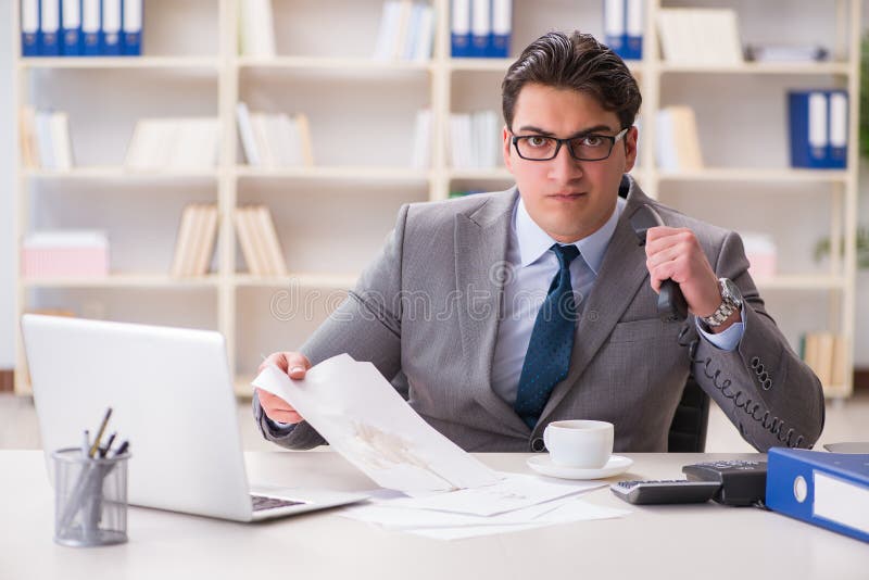 The Businessman Spilling Coffee on Important Documents Stock Image