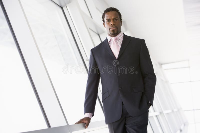 Two Businessmen Sitting In Office Lobby Talking Stock Image - Image of ...