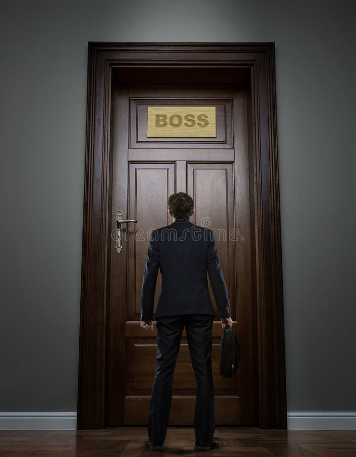 Businessman standing in front of the huge door royalty free stock images