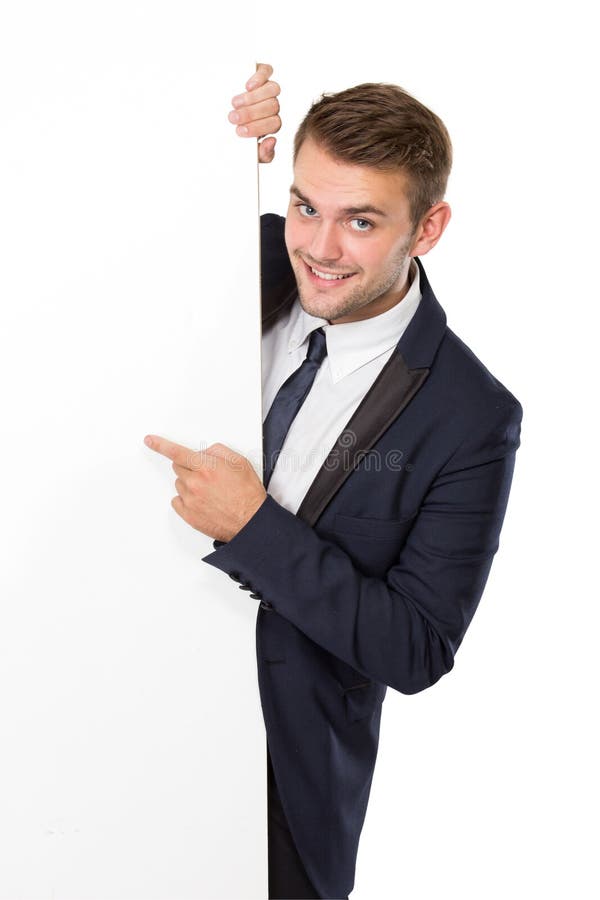 Businessman standing next to a blank white billboard stock images Businessman standing next to a blank white billboard stock images