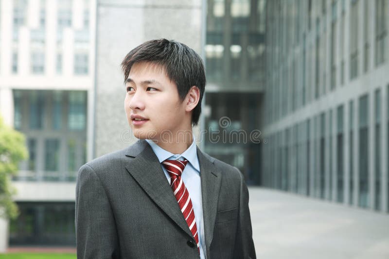 Businessman is standing outdoor