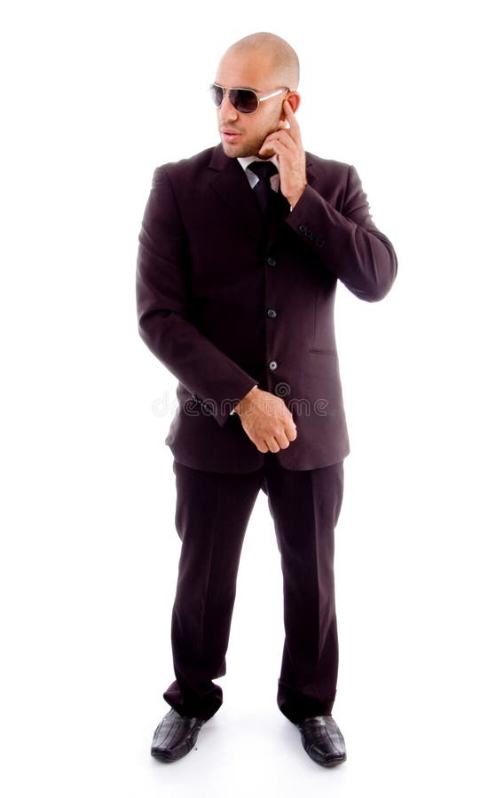 Businessman in standing pose stock photography