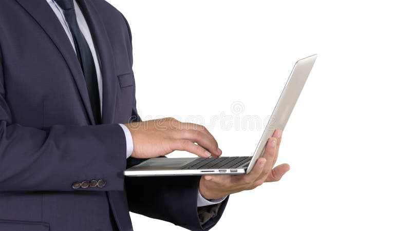 Businessman standing and using laptop on white background. stock photography