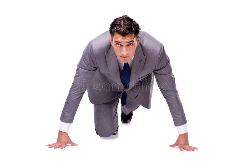 The businessman on start ready for running isolated on white stock photo The businessman on start ready for running isolated on white stock photo