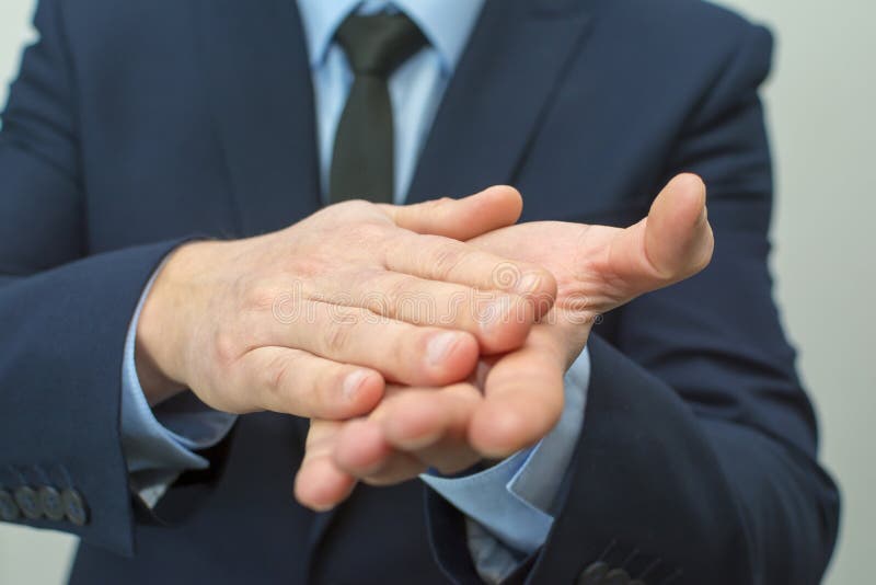 Business Man Rubbing His Hands Together. Stock Photo - Image of good ...