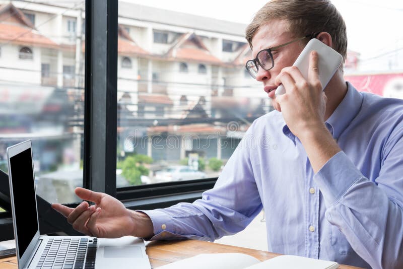 Businessman talk on mobile phone at office. young man call on sm stock images Businessman talk on mobile phone at office. young man call on sm stock images