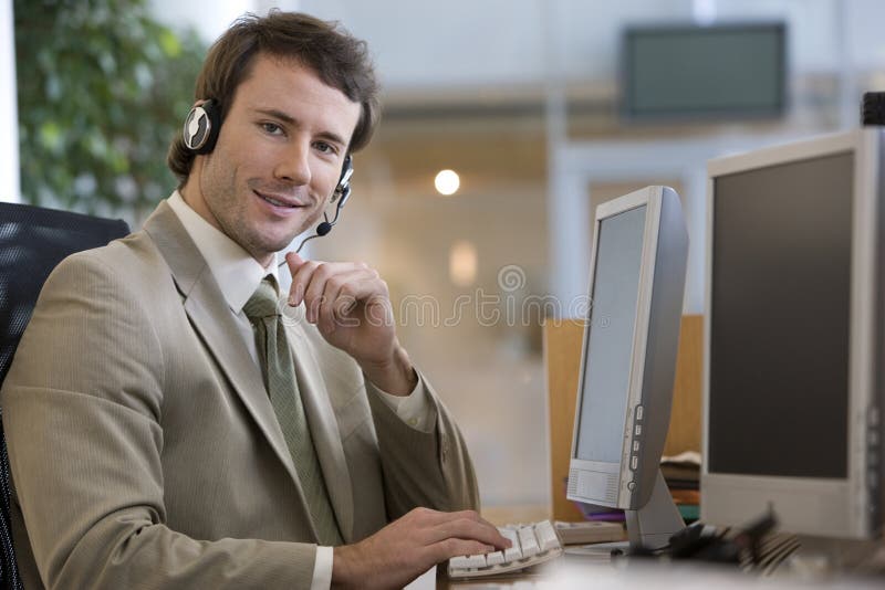 Businessman talking on a headset stock image